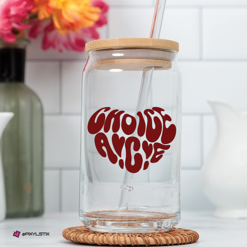 Glass tumbler with a text saying choice ace in a red heart shaped decal