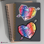 Notebook with geometric heart and arrow stickers on a gray background