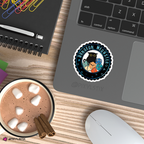 Laptop with a sticker on a desk with hot chocolate and cinnamon sticks