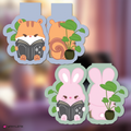Hongjoong and Seonghwa bookmarks with plants on a blurred background