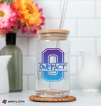 Clear glass tumbler with wooden lid and straw on a coaster, featuring 'ONEPACT' logo, with flowers and kitchen items in the background.