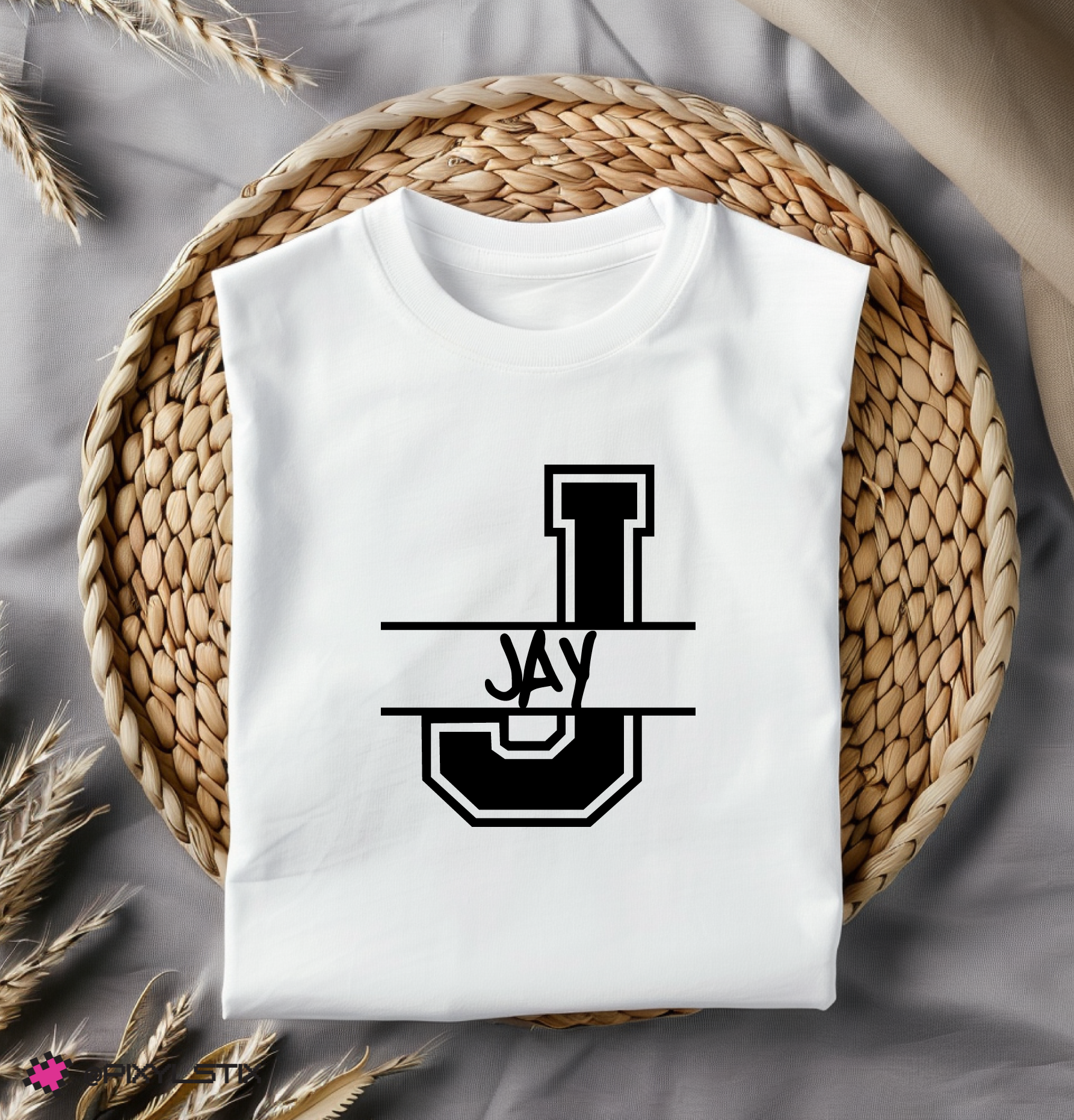 White t-shirt with black logo on a woven mat