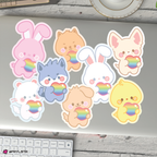 Set of skzoo stickers with rainbow hearts on a desk