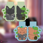 Wooyoung and Jongho bookmarks with plants and books on a blurred background.