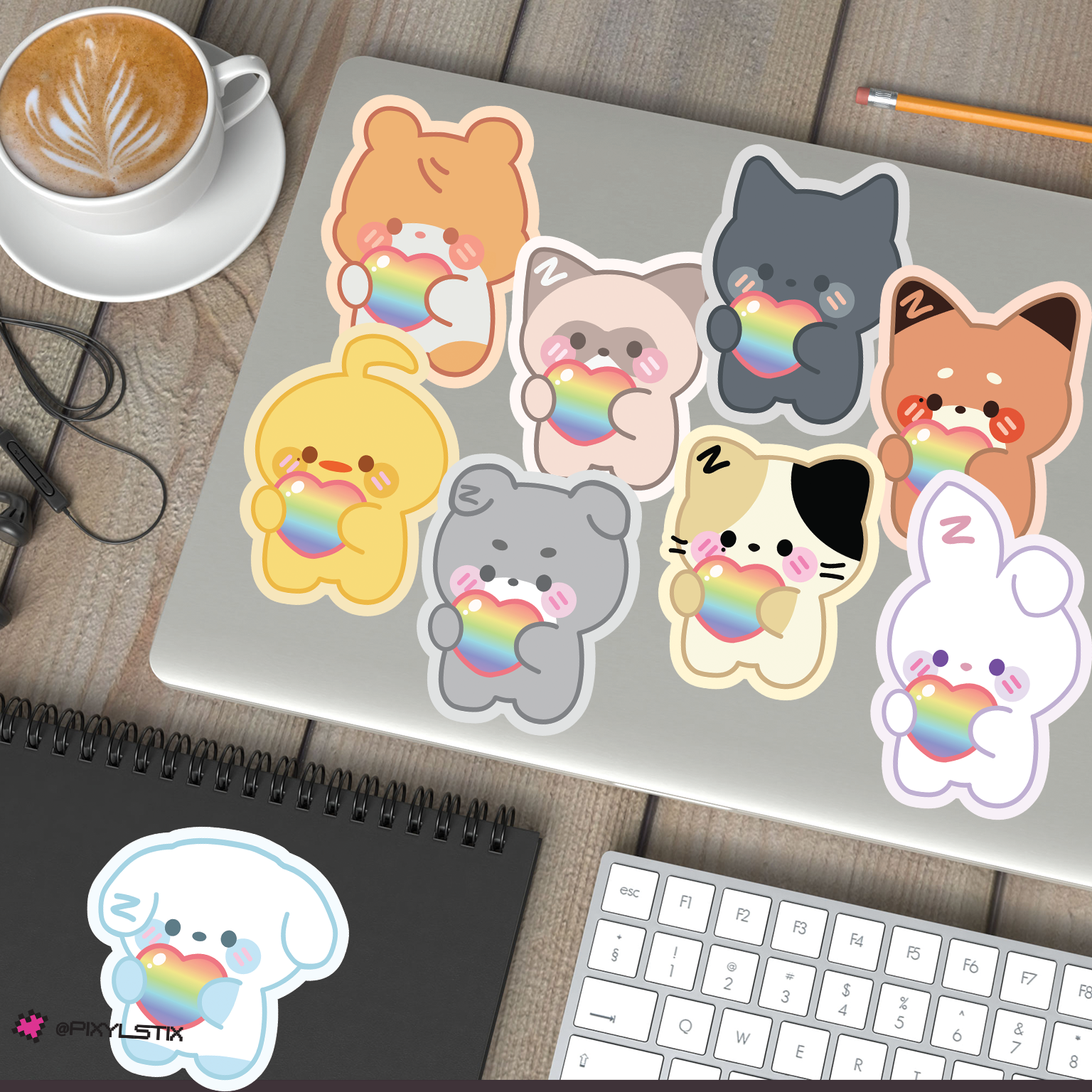 Zeroni pride stickers on a laptop with a cup of coffee and keyboard in the background