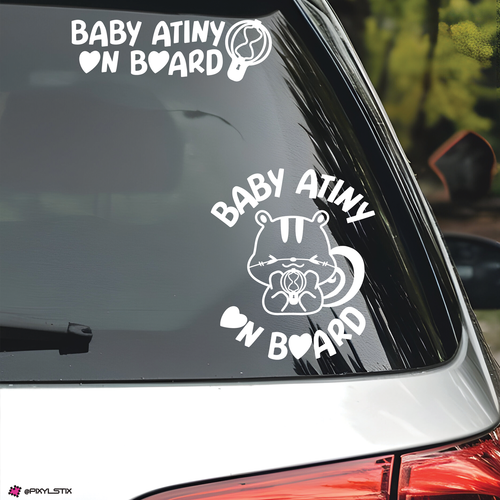 Car window with 'Baby Atiny On Board' decal