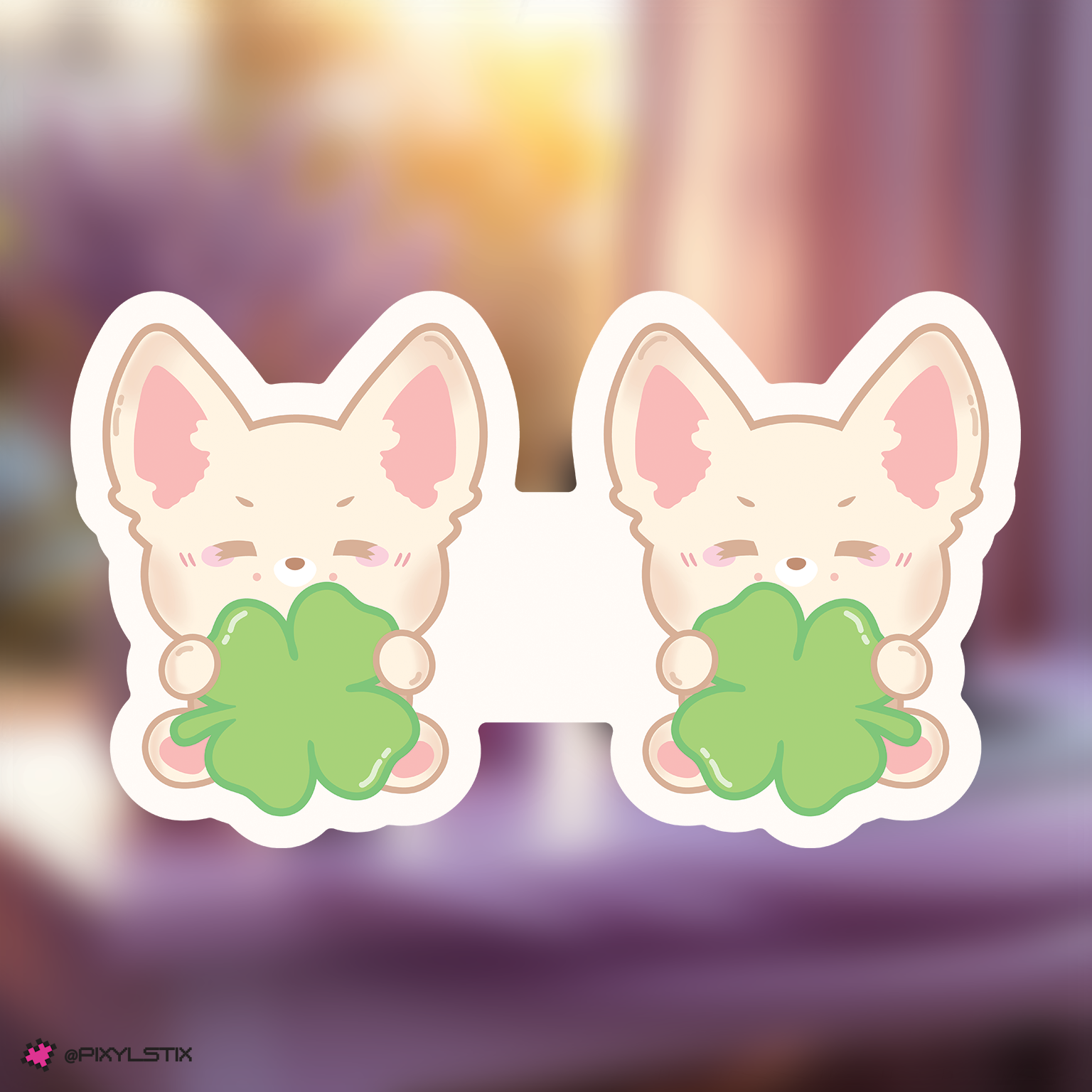 skzoo foxl.ny bookmark holding clover leaves on a blurred background