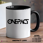 White mug with black handle and logo on a wooden surface