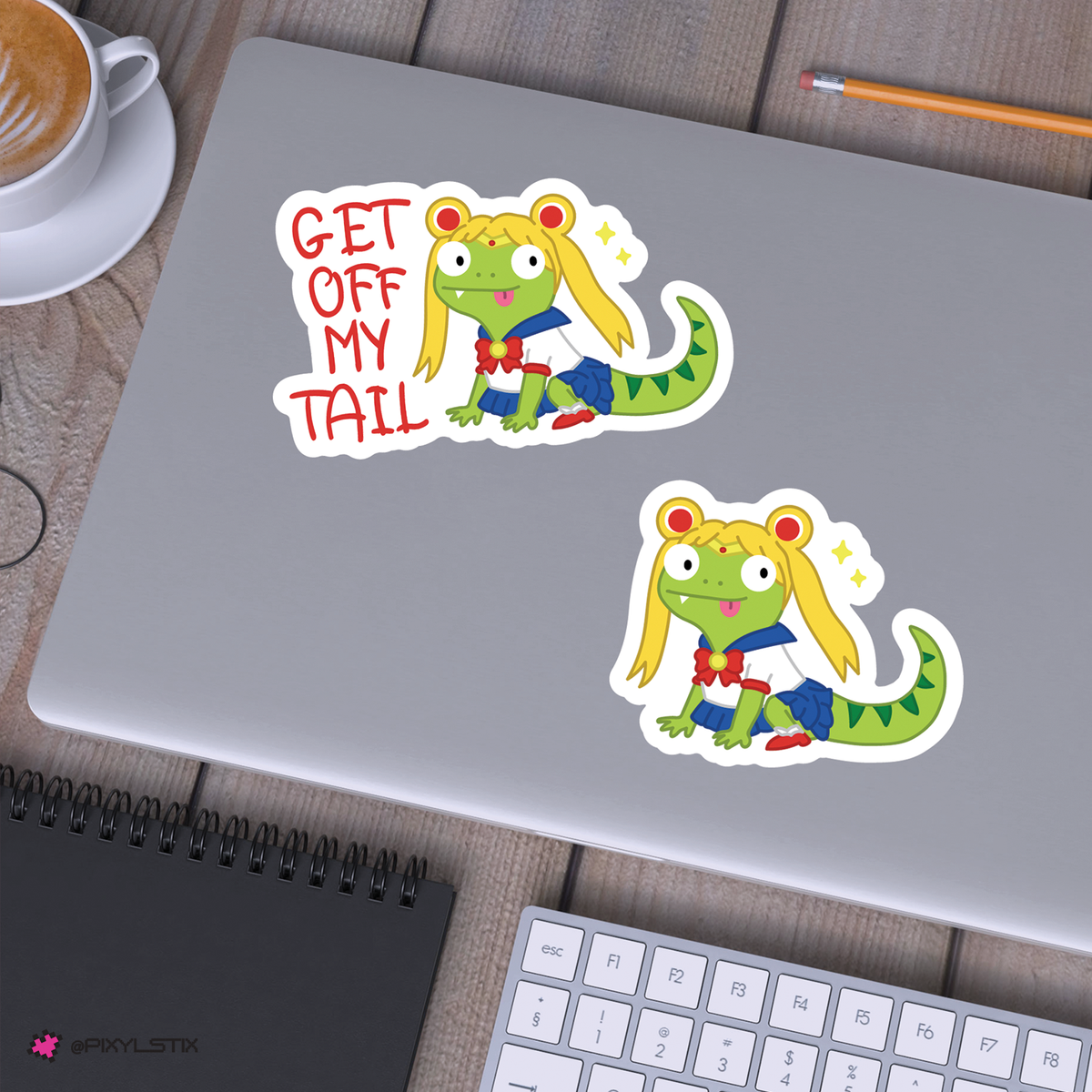 set of cartoon lizard stickers with yellow hair on a silver laptop.