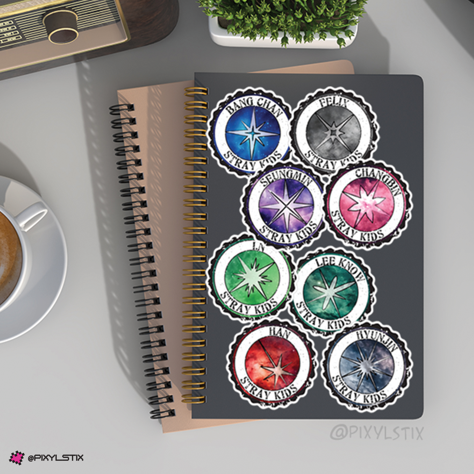 Notebook with Stray Kids 5star stickers on a desk with coffee and plant